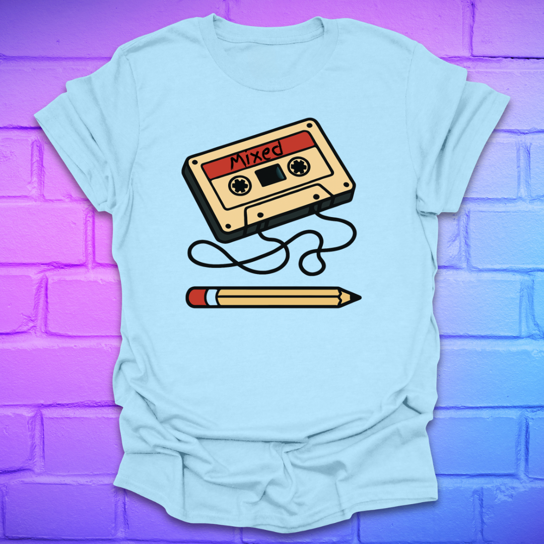Light blue t-shirt with a cassette tape and pencil graphic on a purple brick wall background