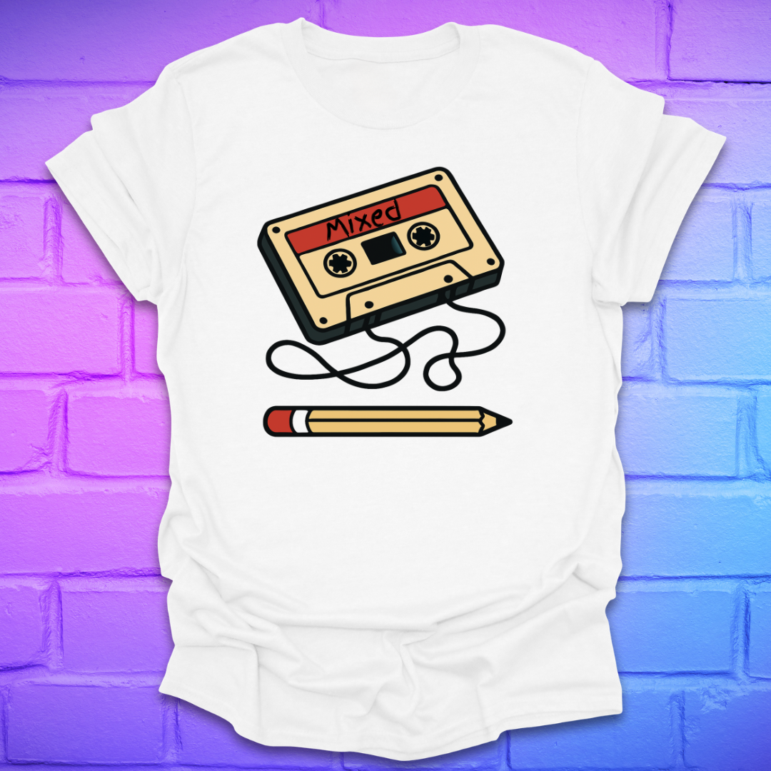 White t-shirt with a cassette tape and pencil graphic on a purple brick wall background