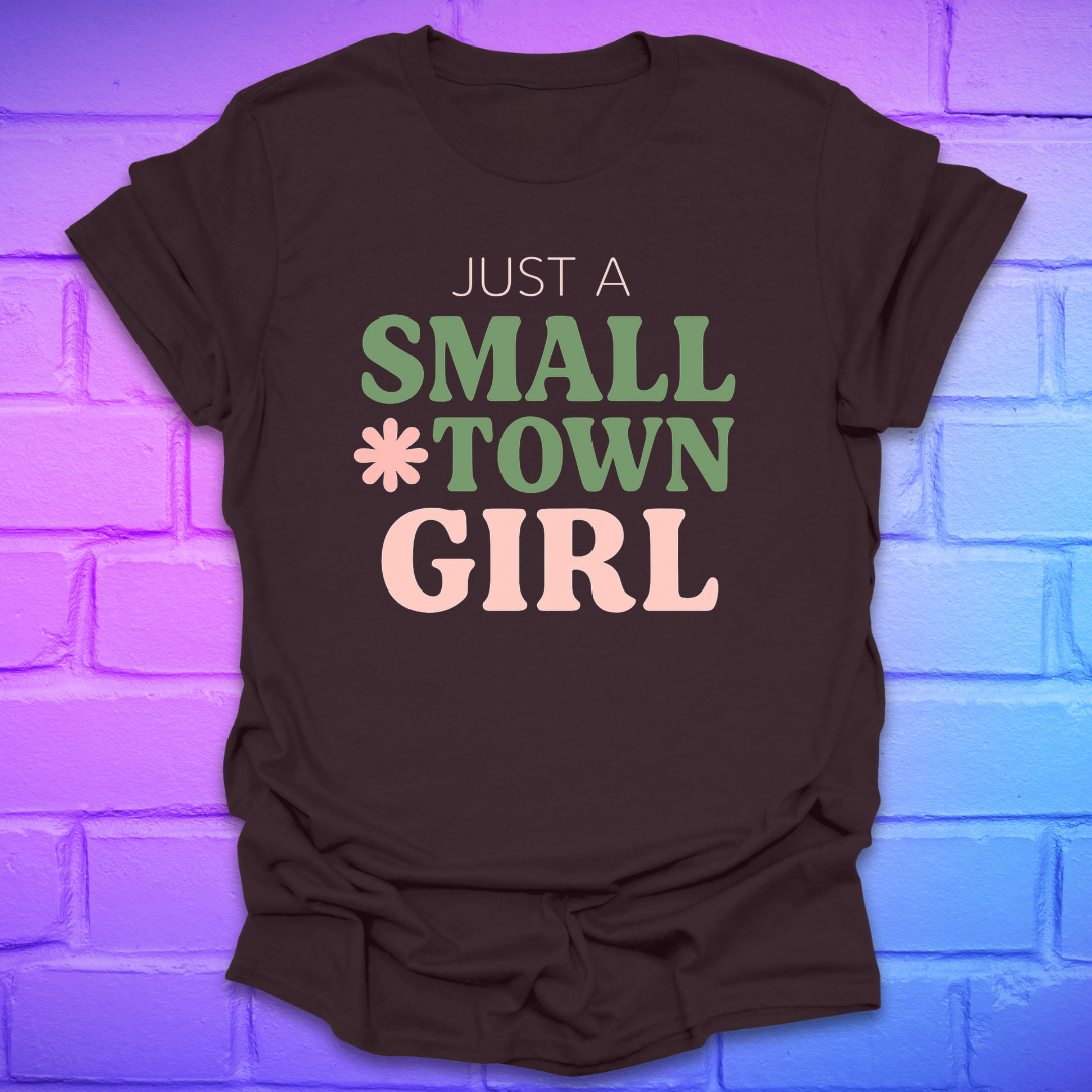 Brown t-shirt with 'Just a Small Town Girl' text on a brick wall background