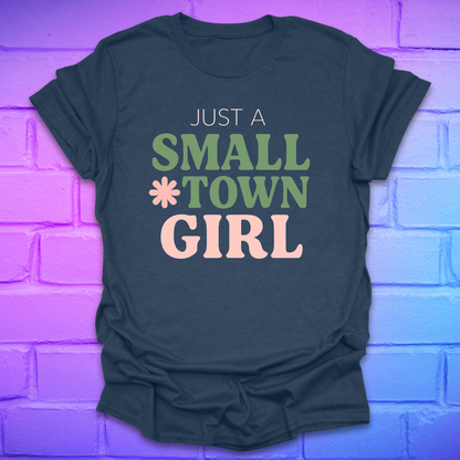 Navy blue t-shirt with 'Just a Small Town Girl' text on a brick wall background