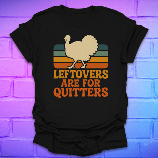 Black t-shirt with a graphic of a turkey and text 'LEFTOVERS ARE FOR QUITTERS' on a brick wall background.