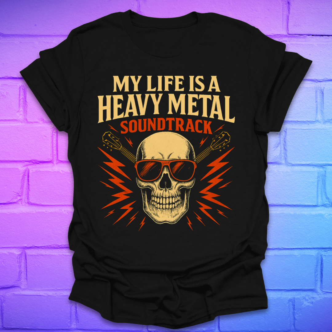 Black t-shirt with a skull and guitar graphic and text, 'my life is a heavy metal soundtrack' on a brick background.