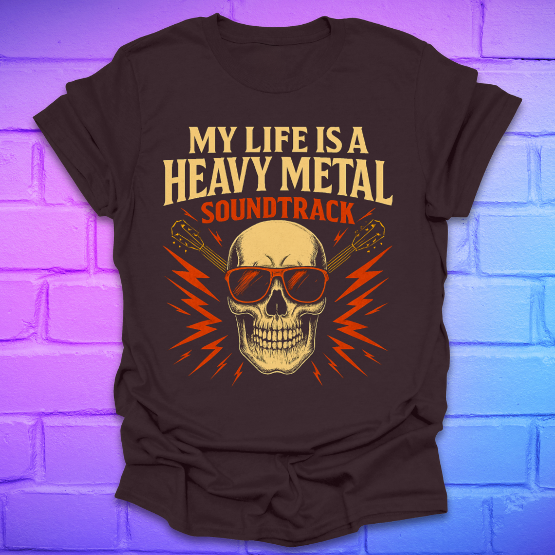 Brown t-shirt with a skull and guitar graphic and text, 'my life is a heavy metal soundtrack' on a brick background.