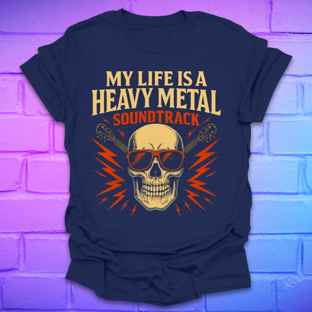 Navy blue t-shirt with a skull and guitar graphic and text, 'my life is a heavy metal soundtrack' on a brick background.