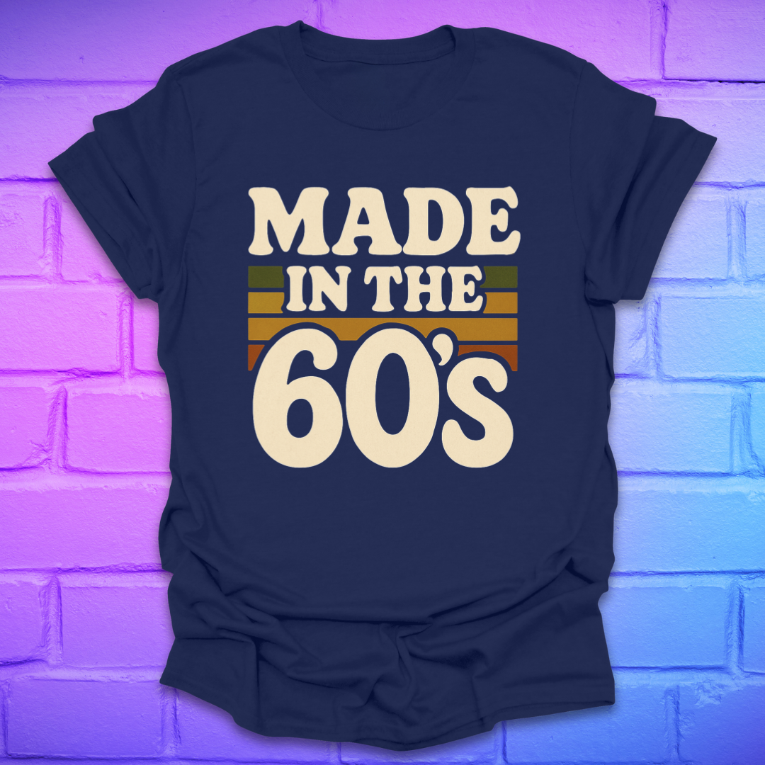 Navy blue t-shirt with 'Made in the 60's' text on a brick wall background