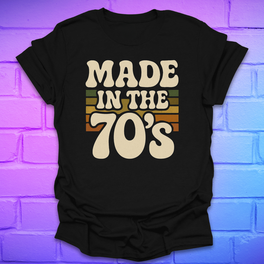 Black t-shirt with 'Made in the 70's' text on a brick wall background