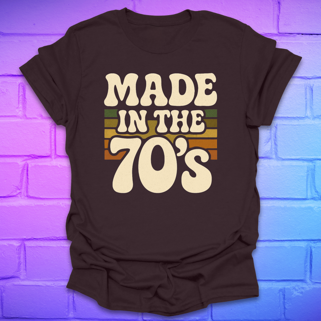 Brown t-shirt with 'Made in the 70's' text on a brick wall background