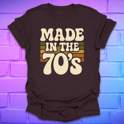 Brown t-shirt with 'Made in the 70's' text on a brick wall background