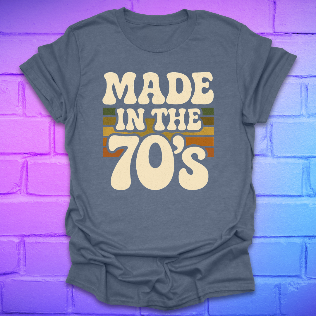 Heather Indigo t-shirt with 'Made in the 70's' text on a brick wall background
