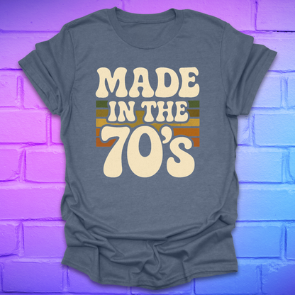 Heather Indigo t-shirt with 'Made in the 70's' text on a brick wall background