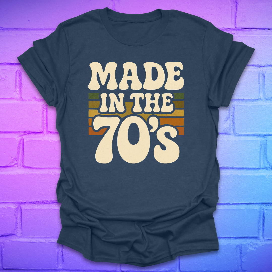 Navy blue t-shirt with 'Made in the 70's' text on a brick wall background