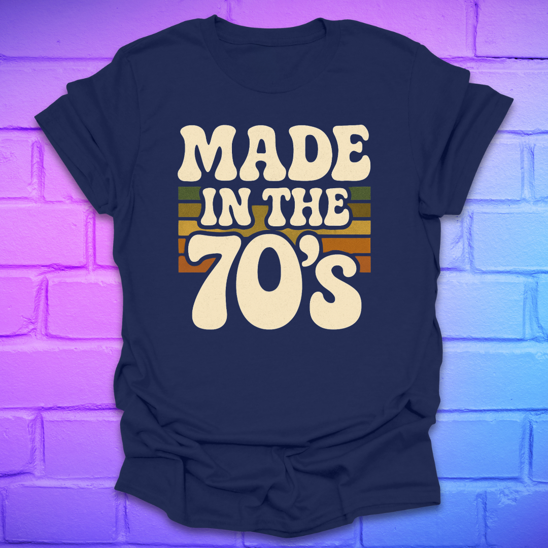 Navy blue t-shirt with 'Made in the 70's' text on a brick wall background