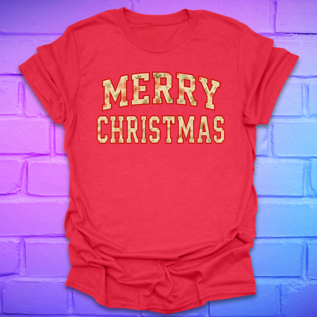 Red t-shirt with 'Merry Christmas' camo text on a brick wall background