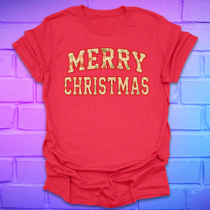 Red t-shirt with 'Merry Christmas' camo text on a brick wall background