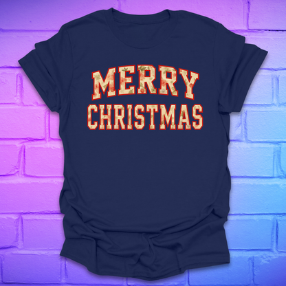 Navy t-shirt with 'Merry Christmas' camo text on a brick wall background