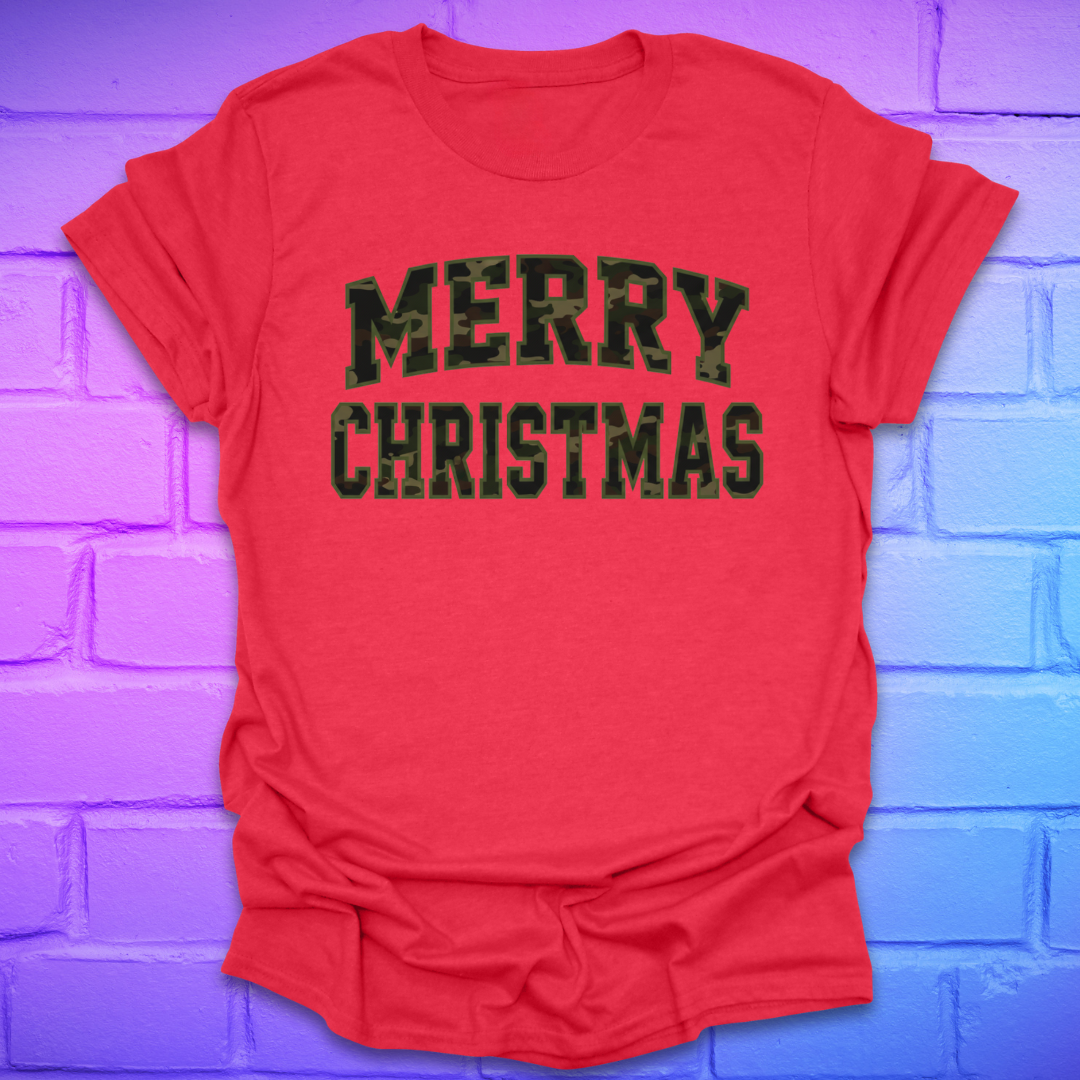 Red t-shirt with 'Merry Christmas' camo text on a brick wall background