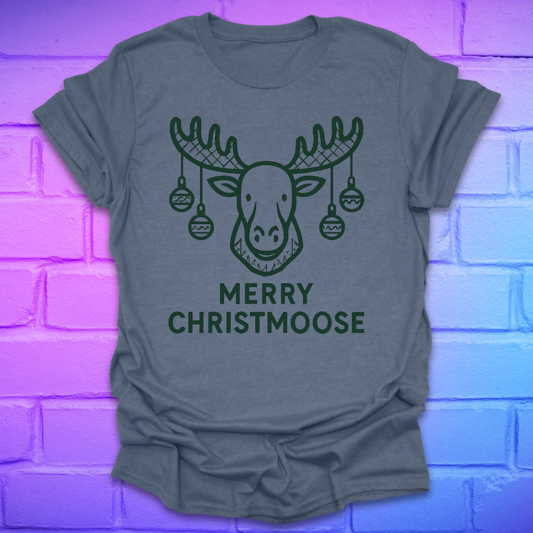 Indigo colored t-shirt with a moose graphic and 'Merry Christmoose' text on a brick wall background