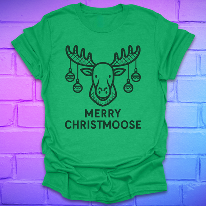 Green t-shirt with a moose graphic and 'Merry Christmoose' text on a brick wall background