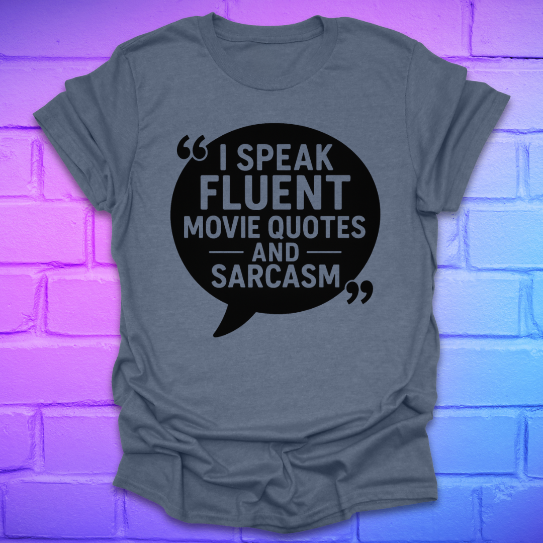 Heather indigo t-shirt with a black speech bubble graphic and text, on a brick wall background