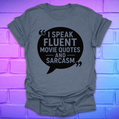 Heather indigo t-shirt with a black speech bubble graphic and text, on a brick wall background