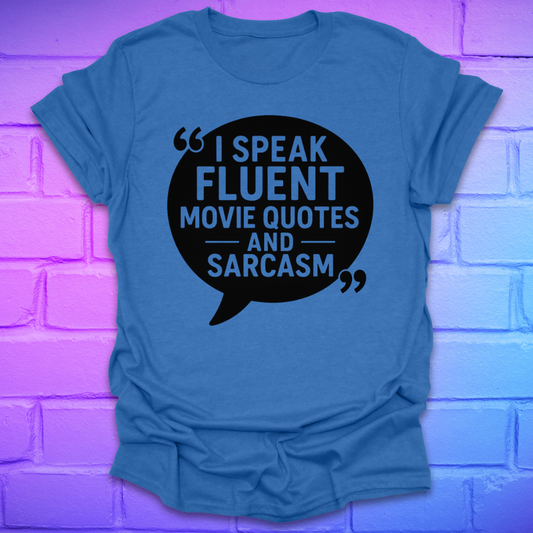 Heather royal t-shirt with a black speech bubble graphic and text on a purple brick wall background