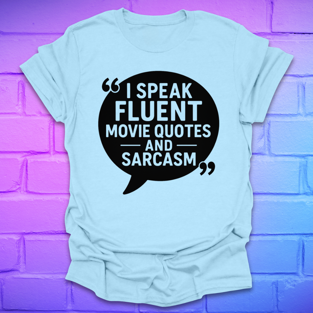 Light blue t-shirt with a speech buble and text on a purple brick wall background