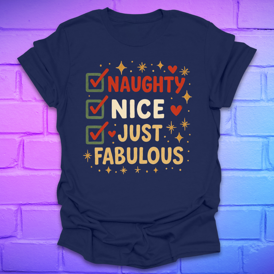 Navy t-shirt with colorful text design, 'naughty nice, just fabulous' on a brick wall background