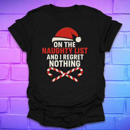 Black t-shirt with Christmas-themed text, 'on the naughty list and i regret nothing' and graphics on a brick wall background