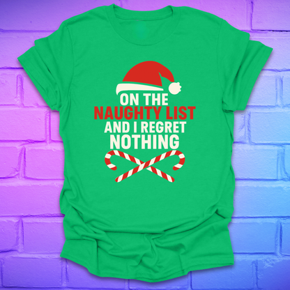 Green t-shirt with Christmas-themed text, 'on the naughty list and i regret nothing' and graphics on a brick wall background