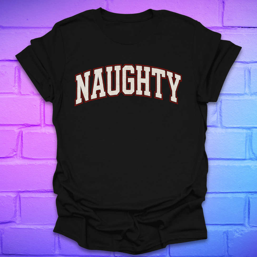 Black t-shirt with 'NAUGHTY' text on a brick wall background