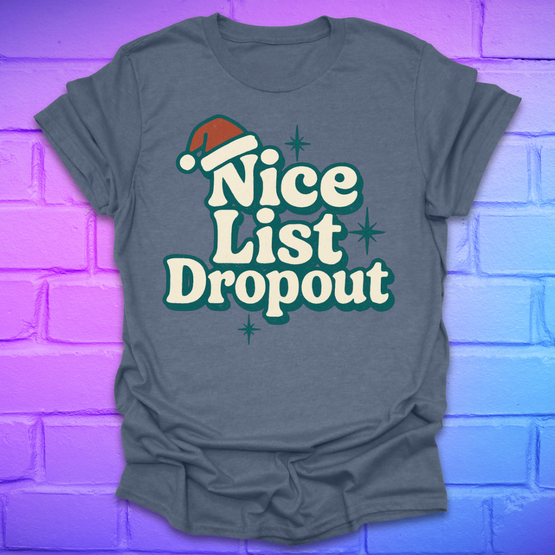 Indigo t-shirt with 'Nice List Dropout' text and Santa hat graphic on a brick wall background