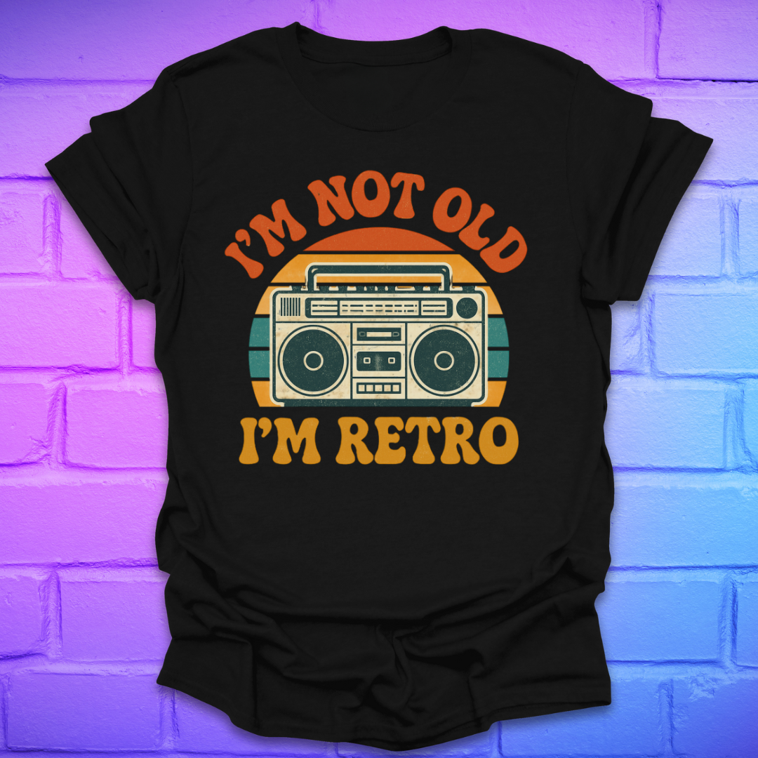 Black t-shirt with 'I'm not old, I'm retro' graphic design on a brick wall background