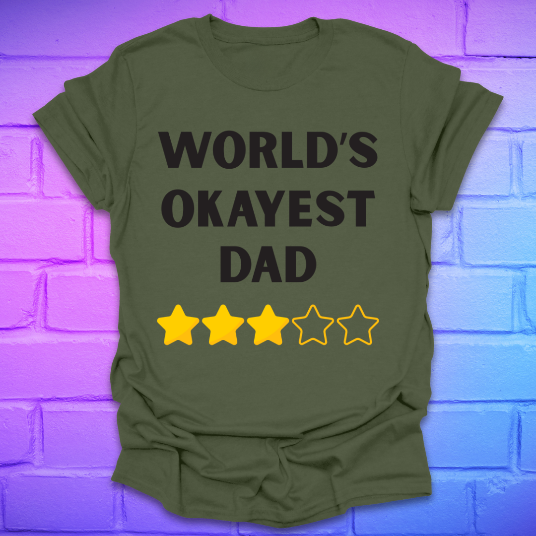 Green t-shirt with 'World's Okayest Dad' text and star ratings on a brick wall background