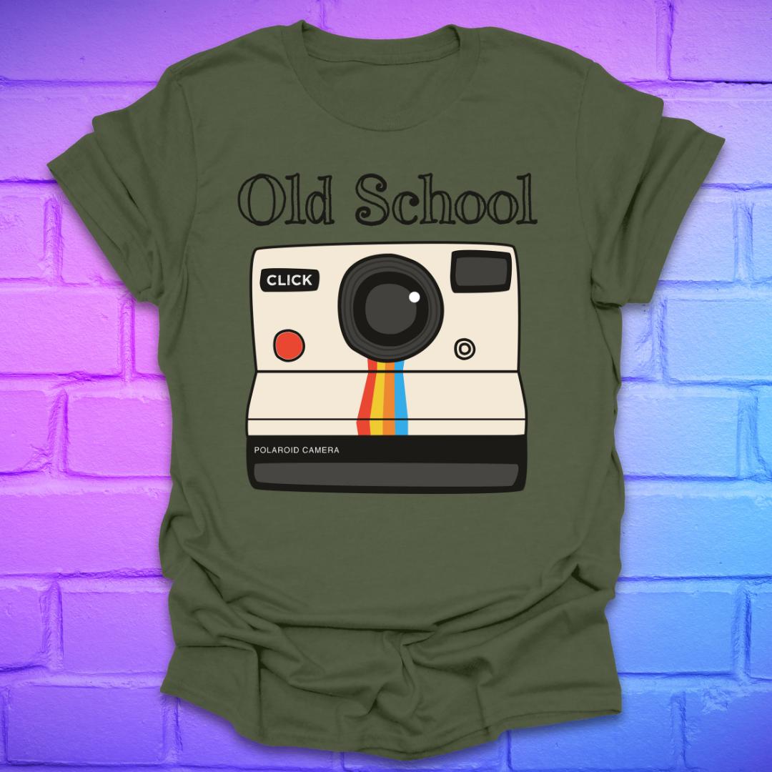 Green t-shirt with a graphic of an polaroid camera and 'Old School' text on a brick wall background.