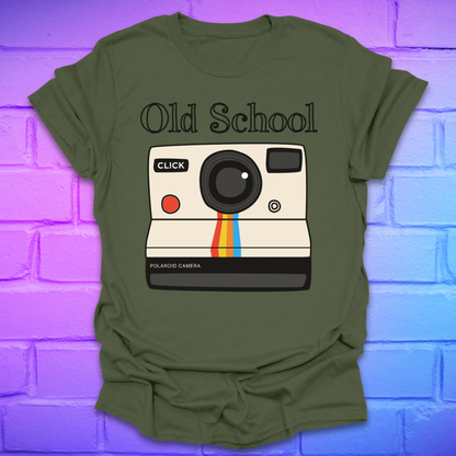 Green t-shirt with a graphic of an polaroid camera and 'Old School' text on a brick wall background.