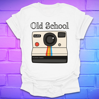White t-shirt with a graphic of an polaroid camera and 'Old School' text on a brick wall background.