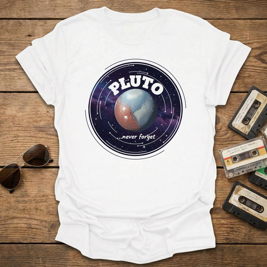 White t-shirt with Pluto graphic design on a wooden surface with vintage tapes and sunglasses.