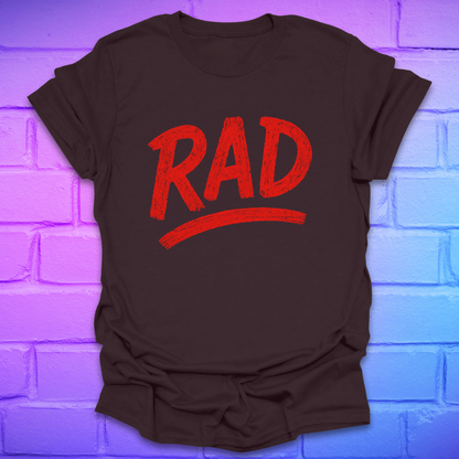 Brown t-shirt with red 'RAD' text on a brick wall background