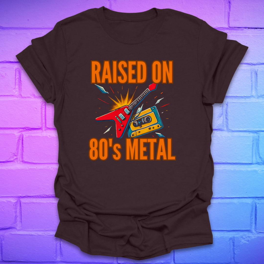 Brown t-shirt with 'Raised on 80's Metal' graphic design on a brick wall background