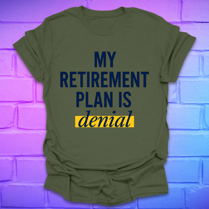 Green t-shirt with 'My Retirement Plan is Denial' text on a brick wall background
