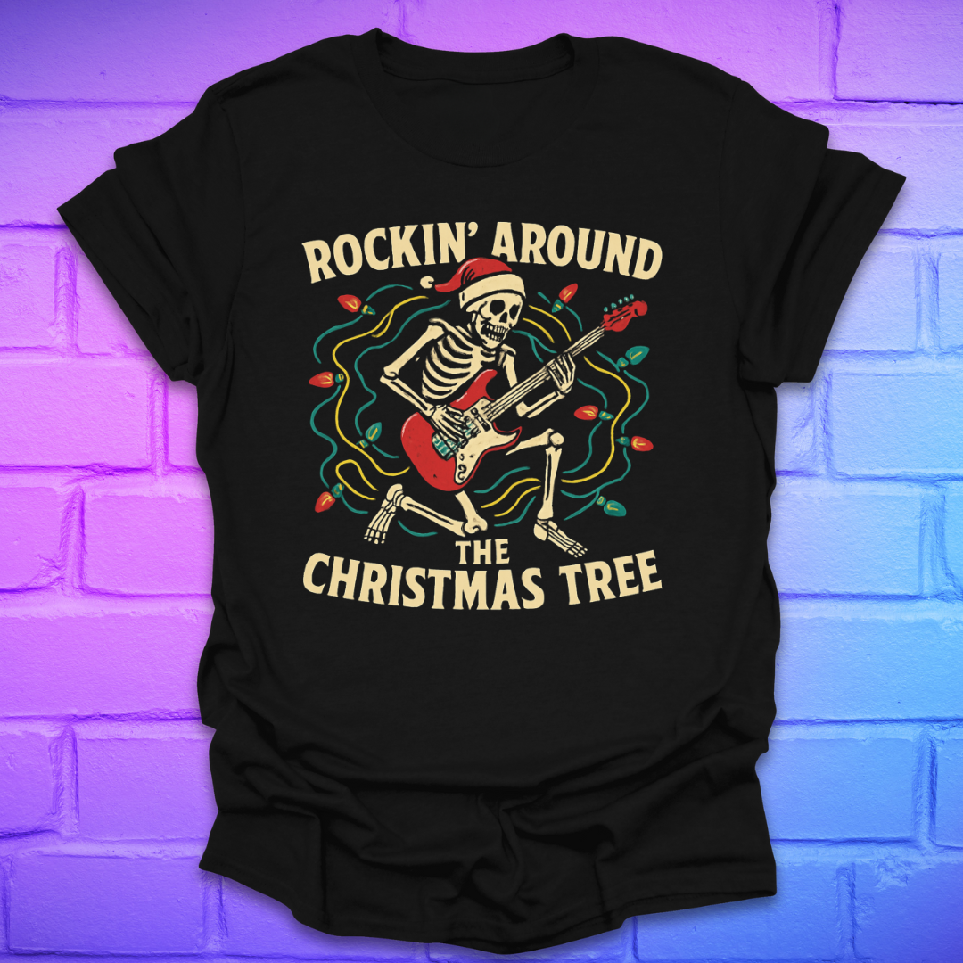 Black t-shirt with skeleton playing guitar and text 'Rockin' Around the Christmas Tree' on a brick wall background