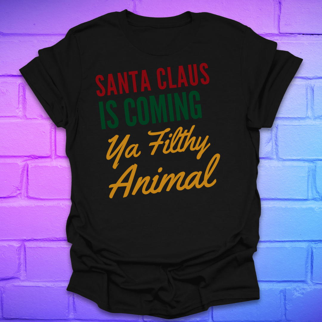 Black t-shirt with colorful text, 'santa claus is coming ya filthy animal' on a brick wall background
