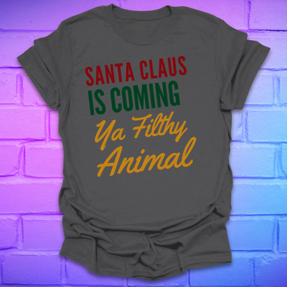 Charcoal colored t-shirt with colorful text, 'santa claus is coming ya filthy animal' on a brick wall background
