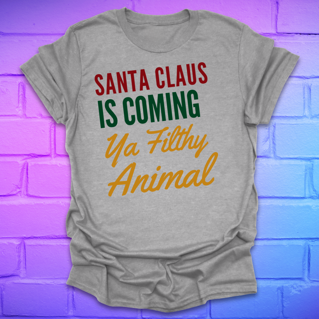 Grey t-shirt with colorful text, 'santa claus is coming ya filthy animal' on a brick wall background