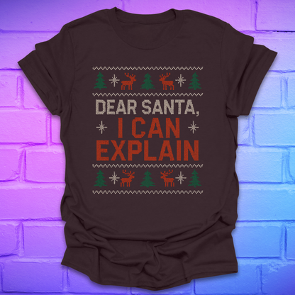 Brown tshirt with text 'dear santa i can explain' with trees and reindeer on a brick background