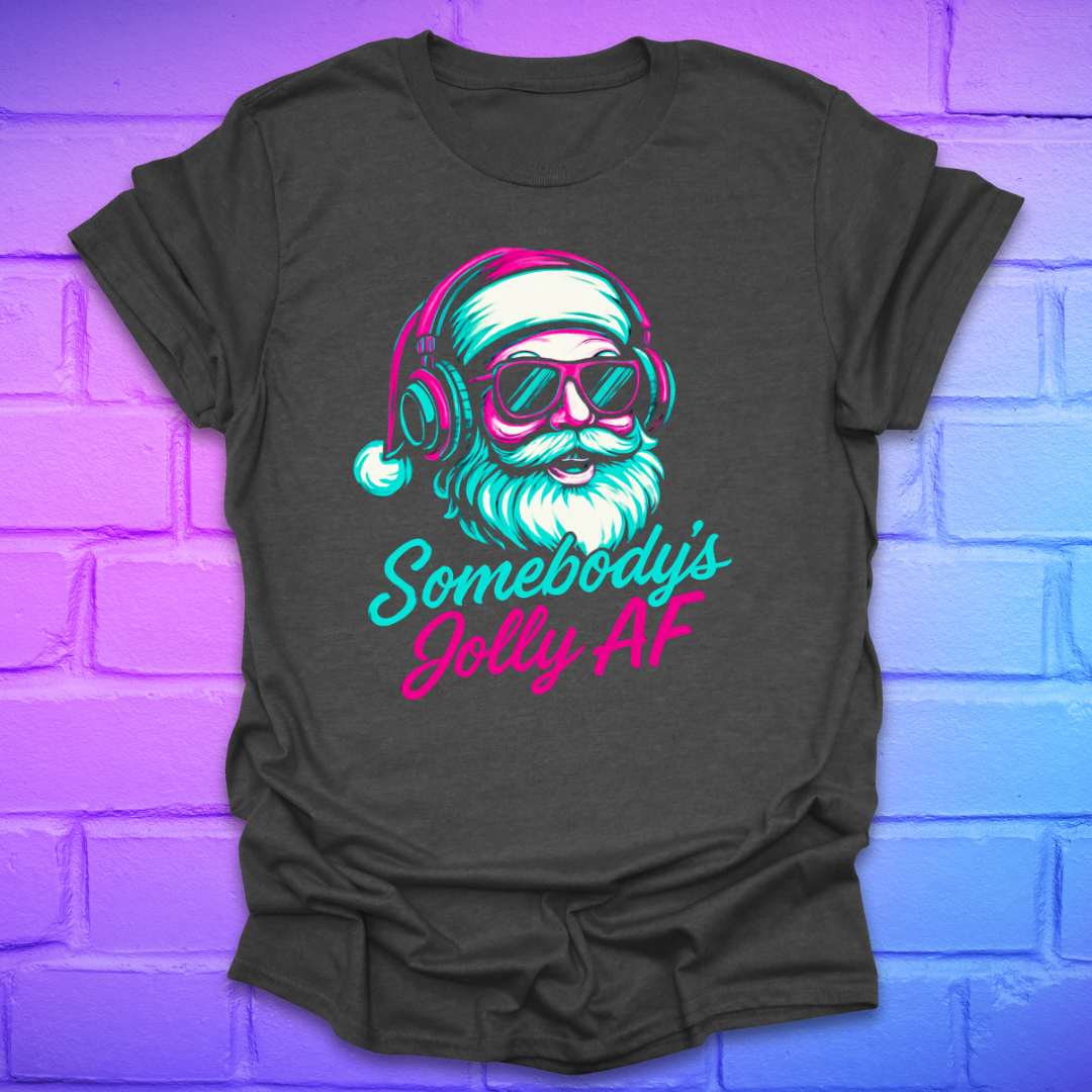 Dark gray t-shirt with a colorful graphic of Santa Claus and text 'Somebody's Jolly AF' on a brick wall background.