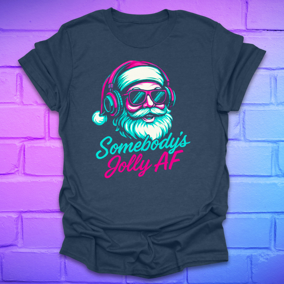 navy T-shirt with a graphic of a Santa Claus wearing headphones and sunglasses, with text 'Somebody's Jolly AF', against a brick wall background.