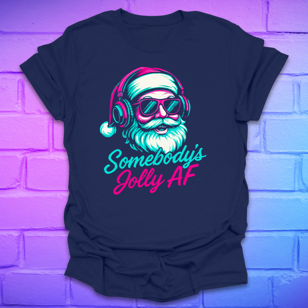 Navy blue t-shirt with a graphic of a Santa Claus wearing headphones and sunglasses, and the text 'Somebody's Jolly AF' on a brick wall background.
