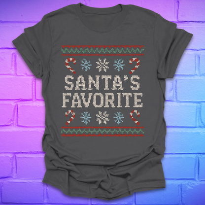 Charcoal colored t-shirt with Christmas-themed design, and text, 'Santa's Favorite' on a brick wall background