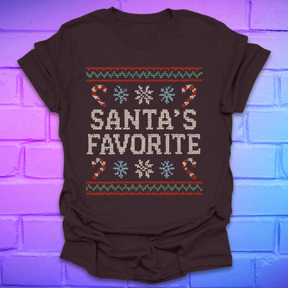 Brown t-shirt with Christmas-themed design, and text, 'Santa's Favorite' on a brick wall background
